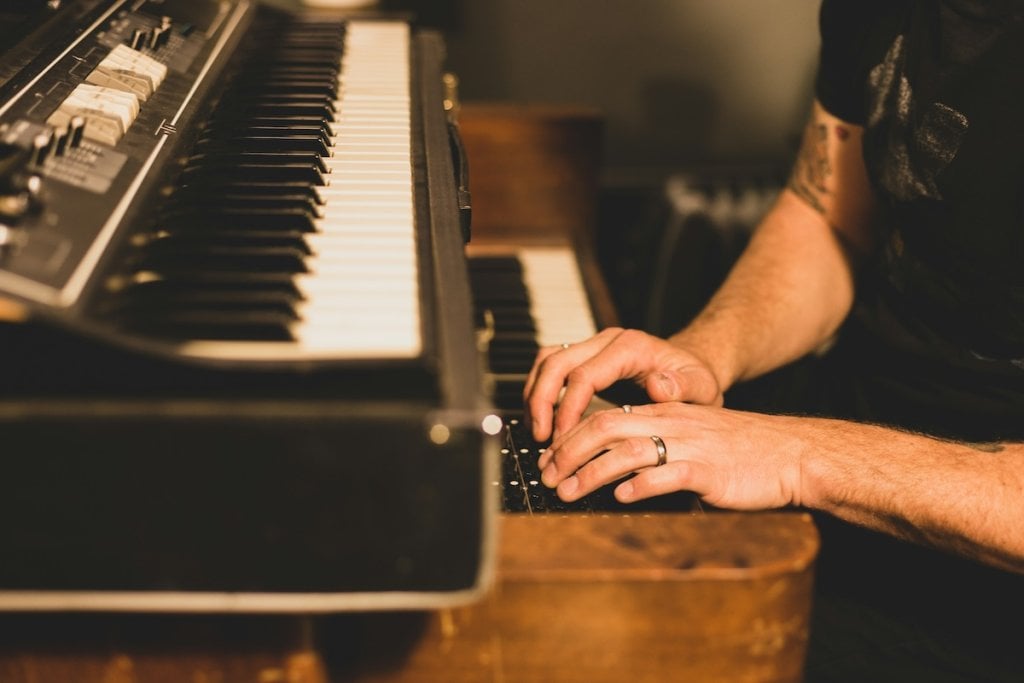 A musician playing an electric organ